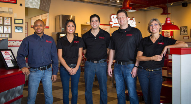 Group of happy Freddy's franchisees